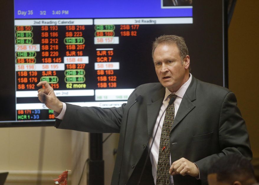 FILE - In this March 2, 2015, file photo, Saratoga Springs Republican Sen. Mark Madsen addresses the Utah Senate, at the Utah State Capitol, in Salt Lake City. After a failed first attempt to pass a medical marijuana law in conservative Utah, Madsen is renewing his push for the bill in an online video where he invokes individual liberty, limited government and the memory of his grandfather, former Mormon church president Ezra Taft Benson. (AP Photo/Rick Bowmer, File)