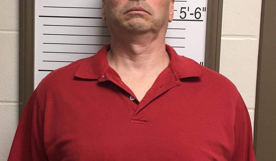 In this Friday, April 24, 2015 photo provided by the Brown County Sheriff's Dept. via the Bloomington Herald-Times Daniel Messel stands against a height board for a booking photo at the Brown County Jail in Nashville, Ind. Messel, of Bloomington, is charged with the murder of IU student Hannah Wilson, whose body was found in Needmore, Ind. Friday morning. (Brown County Sheriff's Dept. via The Herald-Times via AP)