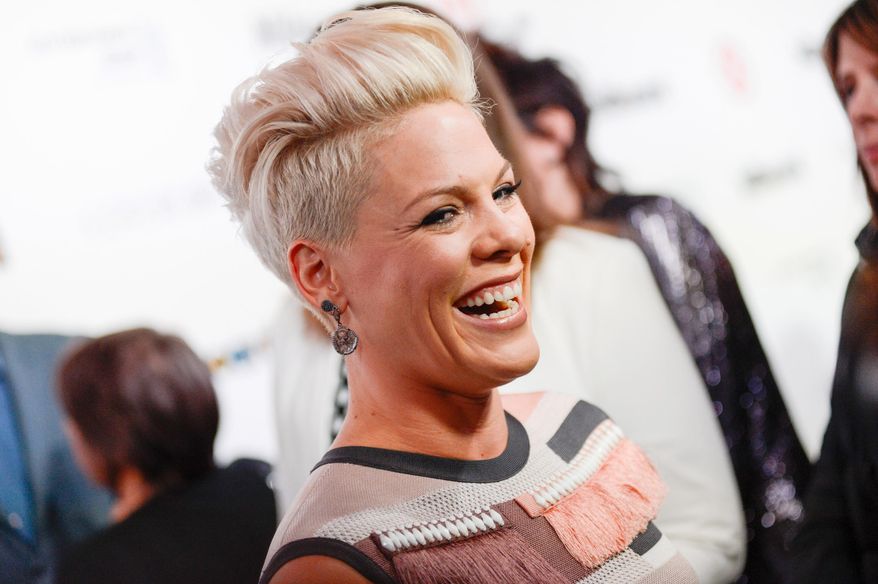 FILE - In a Dec. 10, 2013 file photo, singer Pink arrives at the Billboard Women In Music Awards in New York. A mom’s decision to take her 11-year-old daughter to a Pink concert has a judge saying, “so what?” NJ.com (http://bit.ly/1ORX2UR) reports the girl’s parents are divorced, and her father accused his ex-wife of abusing her parental discretion by taking their daughter to the December 2013 concert at the Prudential Center in Newark. But state Superior Court Judge Lawrence Jones rejected the complaint (Photo by Evan Agostini/Invision/AP, File)