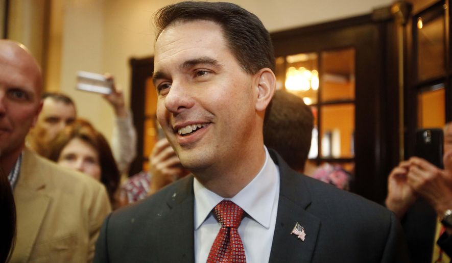 FILE - In This April 18, 2015 file photo, Wisconsin Gov. Scott Walker  smiles as he arrives at the Republican Leadership Summit in Nashua, N.H. For Democratic politicians, same-sex marriage has become an easy issue: They&#39;re for it. Many Republican VIPs, face a far more complicated landscape. Opinion polls show that a majority of Americans, including young Republicans, favor nationwide legalization. A Supreme Court ruling to that effect might be a relief to some GOP candidates, such as Walker, who has made clear that gay marriage is not a favorite topic of discussion.(AP Photo/Jim Cole, File)