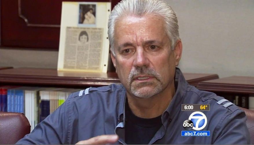 In this April 24, 2015 still from video provided by KABC-TV, retired Santa Ana, Calif., police officer Michael Buelna talks about Robin Barton, now 25, after they are reunited in Santa Ana for the first time since Buelna found Barton as a newborn abandoned in a garbage dumpster. Buelna was on duty on Nov. 21, 1989 when he heard a faint sound coming from a behind a trash bin, sifted through the trash and discovered a baby, his umbilical cord still attached. The child was just four hours old and weighed 4 pounds, 2 ounces. Buelna wanted to adopt him but another Orange County family stepped in first.(KABC-TV via AP) MANDATORY CREDIT TV OUT