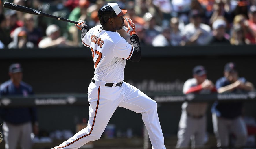 Baltimore Orioles Delmon Young follows through on a two run single against the Boston Red Sox in the fourth inning of a baseball game, Sunday, April 26, 2015, in Baltimore. (AP Photo/Gail Burton)