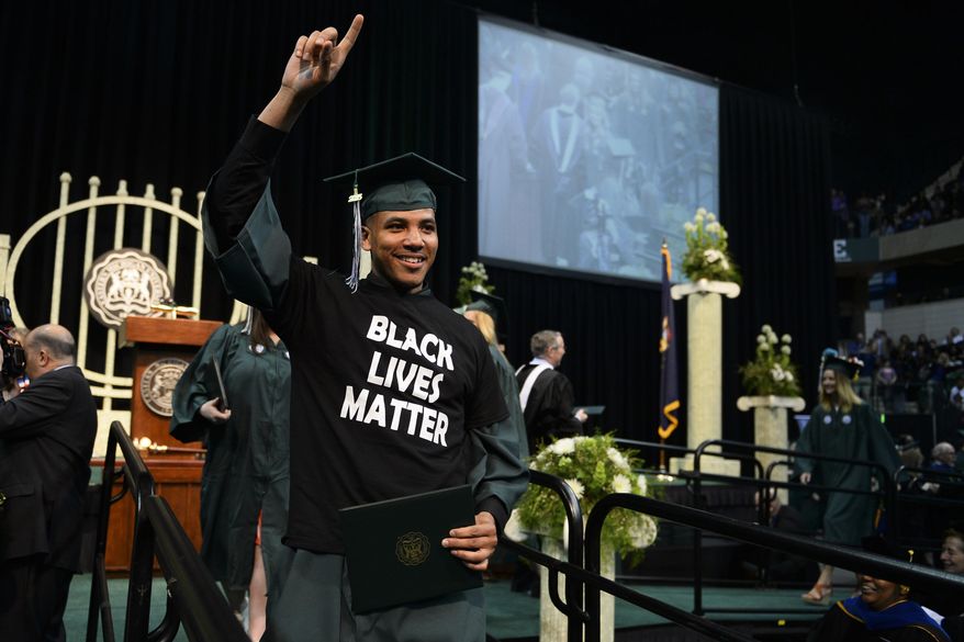 Scenes from Eastern Michigan University's 2015 Commencement ceremony at the Convocation Center in Ypsilanti, Mich., on Sunday, April 26, 2015.(Alex McDougall,/The Ann Arbor News via AP)