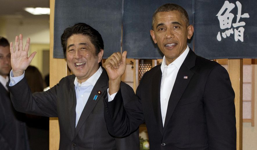 FILE - In this April 23, 2014 file photo, U.S. President Barack Obama and Japanese Prime Minister Shinzo Abe depart Sukiyabashi Jiro sushi restaurant in Tokyo as Obama opens a four-country swing through the Asia-Pacific region. Abe’s itinerary for his eight-day U.S. visit beginning Sunday, April 26, 2015 will showcase the success of the alliance built from Tokyo’s defeat in World War II, while promoting a political agenda based on still stronger military and economic ties. Japanese at right in the background reads: "Sushi." (AP Photo/Carolyn Kaster, File)