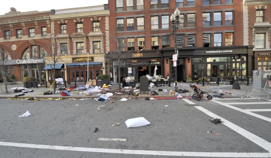 This April 15, 2013 forensics photograph made by the FBI, and provided Thursday, April 23, 2015, by the U.S. Attorney's office, and presented in federal court as evidence during the penalty phase of convicted Boston Marathon bomber Dzhokhar Tsarnaev's trial, shows the scene where the second bomb exploded on Boylston Street near the marathon finish line in Boston. Three people were killed and more than 260 others were wounded when twin bombs exploded. The prosecution rested its case Thursday during the penalty phase of Boston Marathon bomber Dzhokhar Tsarnaev's trial after playing a video showing a mother crouched over her 8-year-old son and resting her head on his chest as he lay dying. (U.S. Attorney's Office via AP)