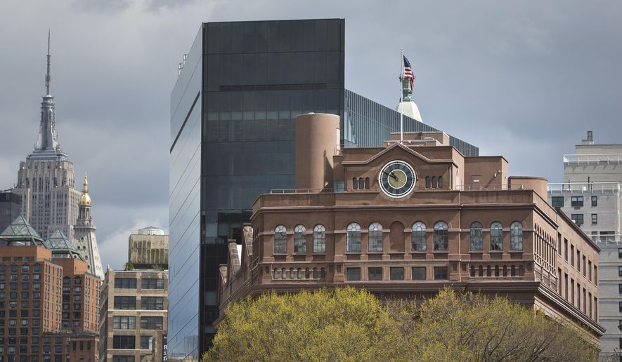 Cooper Union's Foundation Building with its clock tower, one of the tallest in lower Manhattan when it was erected in 1859, rise above tree tops in Cooper Square Park, Thursday, April 23, 2015, in New York. Cooper Union for the Advancement of Science and Art, which produced alumni like Thomas Edison and World Trade Center planner Daniel Libeskind while remaining tuition-free for generations is awaiting the results of a probe that could expose financial mismanagement and tarnish its reputation. (AP Photo/Bebeto Matthews)