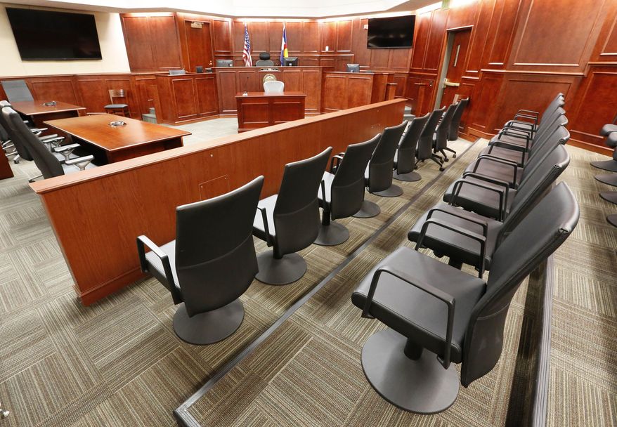 In this Jan. 15, 2015, file photo, the jury box, right, is seen inside Courtroom 201, in Arapahoe County District Court in Centennial, Colo. (AP Photo/Brennan Linsley, Pool, File)