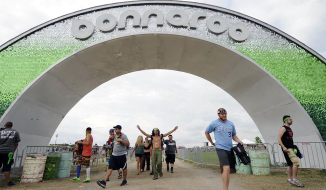 In this June 13, 2014 file photo, festival-goers enter through the arch during Bonnaroo Music &amp;amp; Arts Festival in Manchester, Tenn. (AP Photo/The Knoxville News Sentinel, Adam Lau, File)