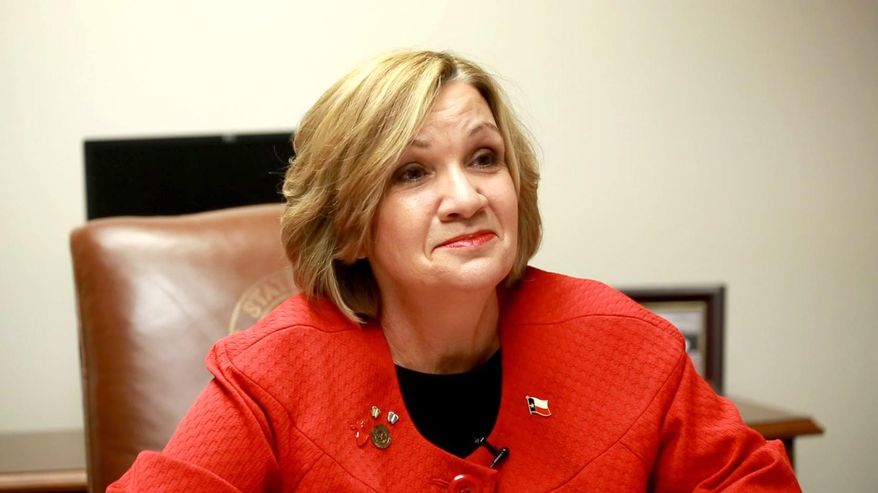 Texas State Rep. Molly White, R-Belton, speaks with a reporter in her office at the Capitol on Wednesday, Feb. 4, 2015 in Austin, Texas. White is part of a bloc of Texas House ultraconservatives who are most aggressively pushing new abortion limits, while Gov. Greg Abbott and other Republican legislative leaders have not prioritized additional restrictions. (Tina Phan/Austin American-Statesman via AP)