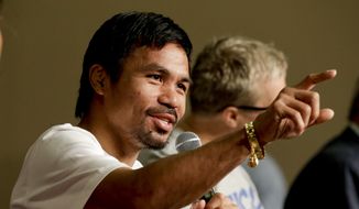 Boxer Manny Pacquiao, of the Philippines, talks during a news conference in Las Vegas, Tuesday, April 28, 2015. Floyd Mayweather Jr. and Manny Pacquiao are scheduled to fight May 2. (AP Photo/Chris Carlson)