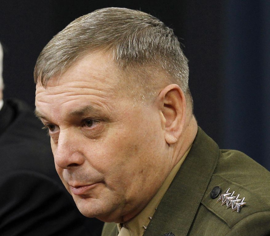 In this April 21, 2011, file photo, Gen. James Cartwright takes part in a news conference at the Pentagon. A former commander of U.S. nuclear forces is leading a call for taking U.S. and Russian nuclear missiles off high alert, arguing that a longer fuse could keep a possible cyberattack from starting a nuclear war and would mean less risk of miscalculation in a crisis. (AP Photo/Alex Brandon, File)