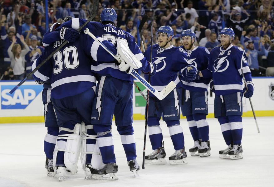 Tampa Bay Lightning players celebrate their 2-0 win over the Detroit Red Wings during Game 7 of a first-round NHL Stanley Cup hockey playoff series Wednesday, April 29, 2015, in Tampa, Fla. (AP Photo/Chris O&#39;Meara)