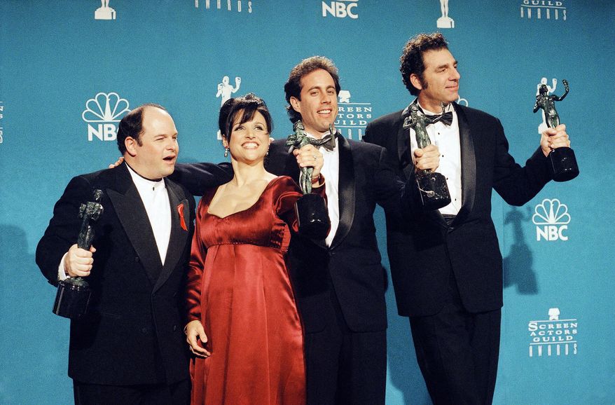 FILE - In this Feb. 22, 1997 file photo, "Seinfeld" cast members, from left, Jason Alexander, Julia Louis-Dreyfus, Jerry Seinfeld and Michael Richards pose together backstage after they won Outstanding Performance by an Ensemble in a Comedy Series at the Screen Actors Guild Awards, in Los Angeles. Online network Hulu on Wednesday, April 29, 2015 announced it has landed exclusive subscription on-demand rights to "Seinfeld" and future AMC series. (AP Photo/Chris Pizzello, File)