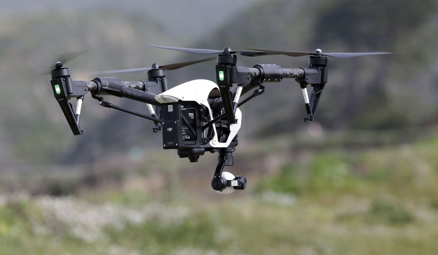 FILE - In this March 10, 2015 file photo, The Inspire 1, a drone manufactured by DJI, is flown in Davenport, Calif. Mexico published rules governing the use of drones on Wednesday, April 29, 2015, allowing people to operate the smallest drones in daylight without a permit but with safety rules. (AP Photo/Marcio Jose Sanchez, File)