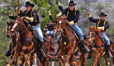 Gunpowder and dirt fly as the 1st Cavalry Division horse detachment make their traditional &#39;cavalry charge&#39; to conclude the 1st Air Cavalry Brigade&#39;s color casing ceremony, March 25, 2009, at Cooper Field, Fort Hood, Texas. U.S. Army photo.