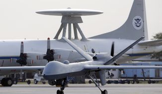 A Predator B unmanned aircraft taxis at the Naval Air Station in Corpus Christi, Texas. (Associated Press) ** FILE **