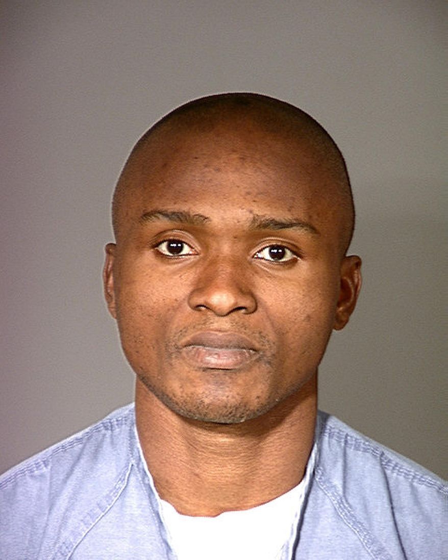 FILE - This February 2000 photo provided by Ventura County Sheriff&#39;s Office shows Charley Saturmin Robinet, aka, Charly Leundeu Keunang, after his arrest for robbery.  Keunang was killed Sunday, March 1, 2015, after a confrontation with police. The family of Keunang has filed a $20 million claim against the city.  (Ventura County Sheriff via AP,File)