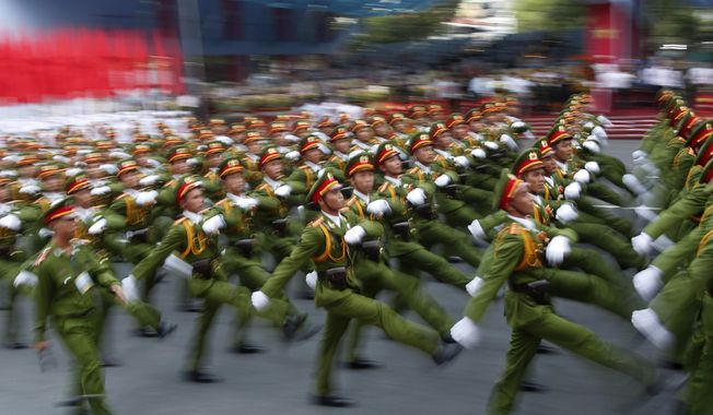 Military personnel take part in a parade celebrating the 40th anniversary of the end of the Vietnam War which is also remembered as the &amp;quot;Fall of Saigon,&amp;quot; in Ho Chi Minh City, Vietnam, Thursday, April 30, 2015. (AP Photo/Dita Alangkara)