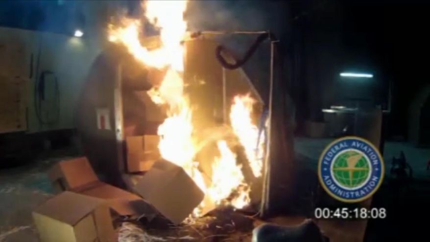 FILE - This file frame grab from video, provided by the Federal Aviation Administration (FAA) shows a test at the FAAs technical center in Atlantic City, N.J. International aviation officials are trying to quickly come up with safer packaging for air cargo shipments of lithium-ion batteries, after U.S. testing confirmed that aircraft fire suppression systems can’t prevent overheated batteries from causing a powerful explosion. Officials familiar with discussions this week at a meeting in Montreal of the International Civil Aviation Organization’s committee on hazardous cargo said the group’s members heard a detailed presentation by aircraft manufacturers and pilot unions on the potential for the batteries to cause an explosion and fire capable of destroying a plane. (FAA, via, File)