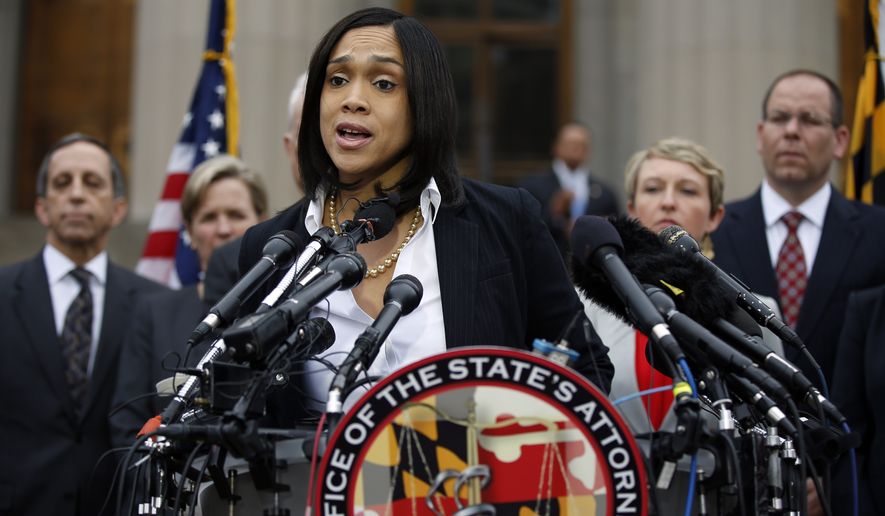 Marilyn Mosby, Baltimore state&#39;s attorney, speaks during a media availability, Friday, May 1, 2015 in Baltimore. Mosby announced criminal charges against all six officers suspended after Freddie Gray suffered a fatal spinal injury while in police custody.  (AP Photo/Alex Brandon)