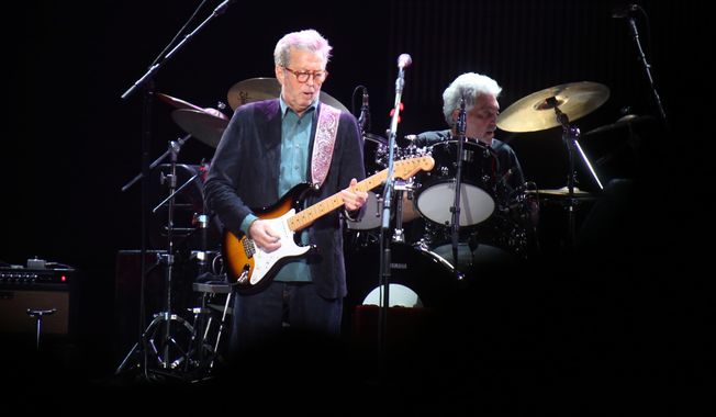Eric Clapton, center, performs during his &amp;quot;70th Birthday Celebration&amp;quot; concert at Madison Square Garden on Friday, May 1, 2015, in New York. (Luiz C. Ribeiro/Invision/AP)