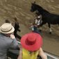 Fans watch a race before the 141st running of the Kentucky Derby horse race at Churchill Downs Saturday, May 2, 2015, in Louisville, Ky. (AP Photo/Charlie Riedel) ** FILE **
