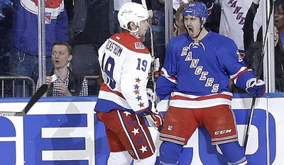 New York Rangers left wing Chris Kreider (20) celebrates in front of Washington Capitals center Nicklas Backstrom (19) after scoring a goal during the first period of Game 2 in the second round of the NHL Stanley Cup hockey playoffs Saturday, May 2, 2015, in New York. (AP Photo/Frank Franklin II)