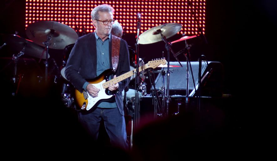 Eric Clapton, center, performs during his &amp;quot;70th Birthday Celebration&amp;quot; concert at Madison Square Garden on Friday, May 1, 2015, in New York. (Luiz C. Ribeiro/Invision/AP) ** FILE **