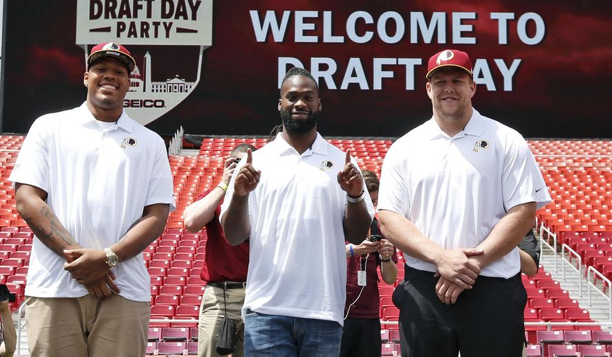 Washington Redskins NFL football draft picks, from left, linebacker Preston Smith, running back Matt Jones, and offensive lineman Brandon Scherff, pause for a photograph during a draft day party Saturday, May 2, 2015, in Landover, Md. (AP Photo/Alex Brandon) ** FILE **