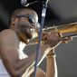 Trombone Shorty performs at the New Orleans Jazz and Heritage Festival in New Orleans, Sunday, May 3, 2015. (AP Photo/Gerald Herbert) ** FILE **