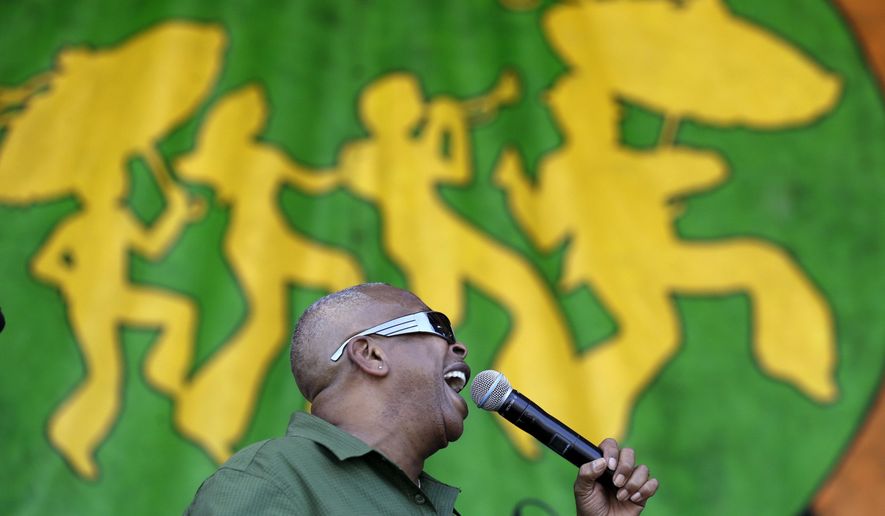 Brother Tyrone performs with his band, Brother Tyrone & the Mindbenders, at the New Orleans Jazz and Heritage Festival in New Orleans, Sunday, May 3, 2015. (AP Photo/Gerald Herbert)