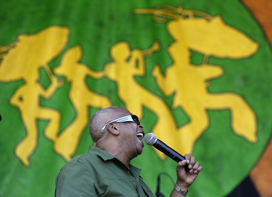 Brother Tyrone performs with his band, Brother Tyrone & the Mindbenders, at the New Orleans Jazz and Heritage Festival in New Orleans, Sunday, May 3, 2015. (AP Photo/Gerald Herbert)