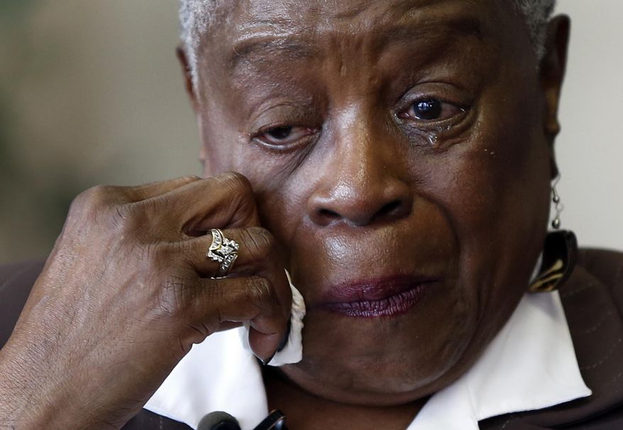 Brenda Stewart wipes away tears Monday, May 4, 2015, in Clayton, Mo., as she recounts the story of how she was told her child had died shortly after giving birth at Homer G. Phillips Hospital in St. Louis. Stewart was 16 and unmarried when she gave birth to a seemingly healthy girl on June 24, 1964, at the hospital. A nurse took the child after birth and returned a short time later to tell Stewart that the baby had died but she now believes her baby may have been stolen and sold to adoptive parents. (AP Photo/Jeff Roberson)