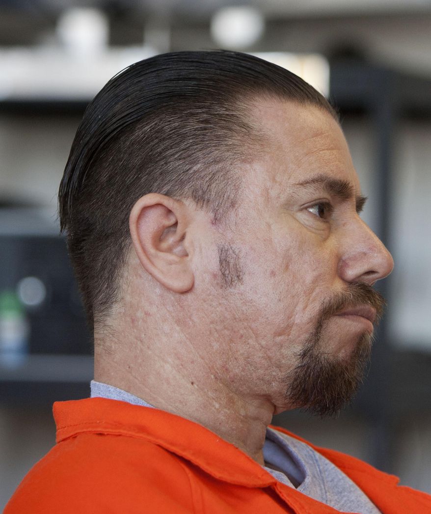 FILE - In this Feb. 7, 2013, file photo, Roberto Roman sits at a desk during his first hearing before the Utah Board of Pardons at the Utah State Prison in Draper, Utah. Lawyers for Roman, a Utah man acquitted at trial in the shooting death of a sheriff's deputy say federal charges against him are double jeopardy, and they're appealing a judge's refusal to toss the case. (Steve Griffin/The Salt Lake Tribune via AP, File) DESERET NEWS OUT; LOCAL TV OUT; MAGS OUT