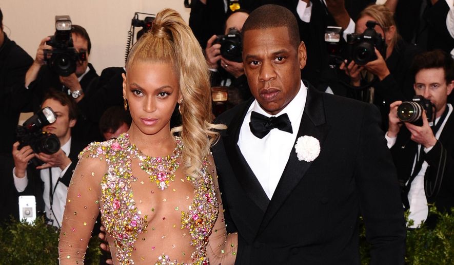 Beyonce, left, and Jay-Z arrive at The Metropolitan Museum of Art&#x27;s Costume Institute benefit gala celebrating &amp;quot;China: Through the Looking Glass&amp;quot; on Monday, May 4, 2015, in New York. (Photo by Charles Sykes/Invision/AP) ** FILE **