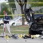 FBI crime scene investigators document evidence outside the Curtis Culwell Center, Monday, May 4, 2015, in Garland, Texas. Two men opened fire with assault weapons on police Sunday night who were guarding a contest for Muslim Prophet Muhammed cartoons. A police officer returned fire killing both men. (AP Photo/Brandon Wade)