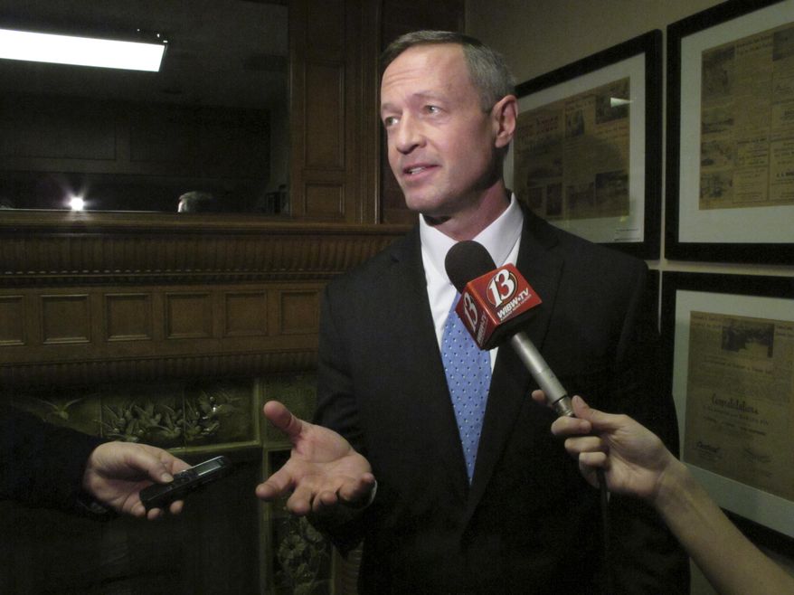 FILE - In this March 7, 2015 file photo, former Maryland Gov. Martin O'Malley talks to reporters in Topeka, Kansas. O'Malley often casts his adopted hometown of Baltimore as the comeback city, a community that overcame the ravages of drugs and violence after he was swept into the mayor's office. Now weeks before the former Maryland governor expects to launch his presidential campaign - and challenge Hillary Rodham Clinton in the Democratic primaries - Baltimore's turnaround has been marred by rioting and unrest after the police-custody death of Freddie Gray. The turmoil has placed new scrutiny on O'Malley's tough-on-crime "zero tolerance" policies as mayor beginning in 1999. (AP Photo/John Hanna, File)
