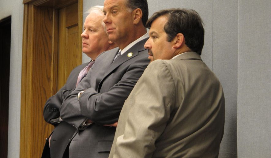 House Speaker Chuck Kleckley, R-Lake Charles, left; Rep. Bryan Adams, R-Gretna, center; and Rep. Jeff Arnold, D-New Orleans, listen to House Ways and Means Committee debate on proposals to scale back tax break spending, on Monday, May 4, 2015, in Baton Rouge, La. (AP Photo/Melinda Deslatte)