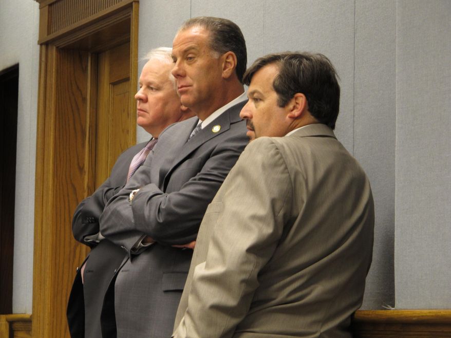 House Speaker Chuck Kleckley, R-Lake Charles, left; Rep. Bryan Adams, R-Gretna, center; and Rep. Jeff Arnold, D-New Orleans, listen to House Ways and Means Committee debate on proposals to scale back tax break spending, on Monday, May 4, 2015, in Baton Rouge, La. (AP Photo/Melinda Deslatte)