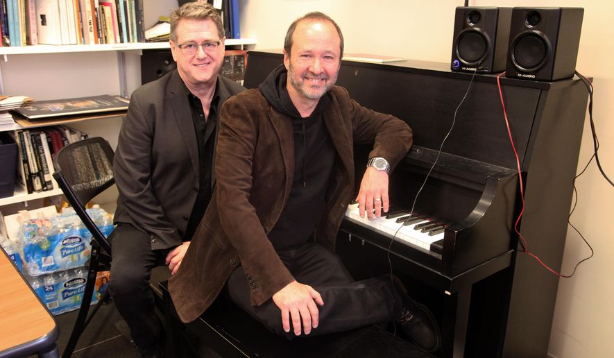 This April 30, 2015 photo shows playwright Robert L. Freedman, left, and composer Steven Lutvak in New York. The duo co-wrote the Tony Award-winning musical "A Gentleman's Guide to Love and Murder” and are being honored by their alma mater, New York University's Tisch School of the Arts. (AP Photo/Mark Kennedy)