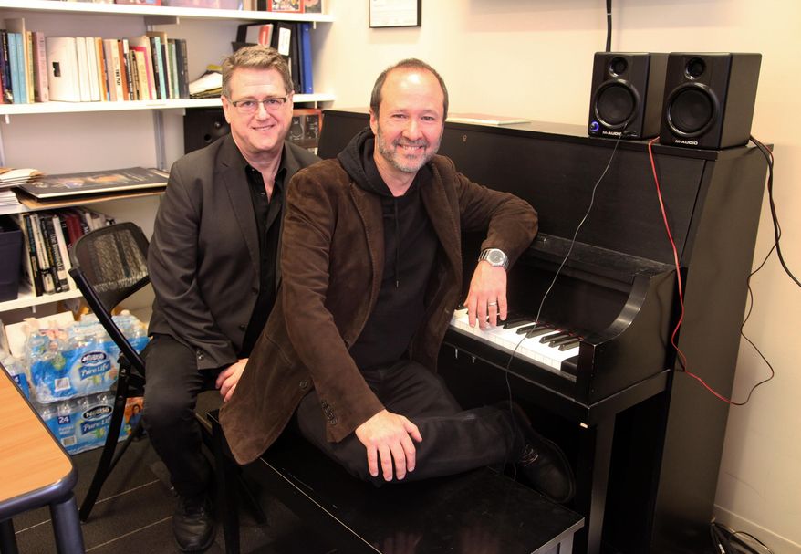 This April 30, 2015 photo shows playwright Robert L. Freedman, left, and composer Steven Lutvak in New York. The duo co-wrote the Tony Award-winning musical "A Gentleman's Guide to Love and Murder” and are being honored by their alma mater, New York University's Tisch School of the Arts. (AP Photo/Mark Kennedy)