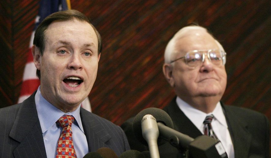 FILE - This Dec. 23, 2003 file photo shows Dan Webb, left, attorney for former Illinois Gov. George Ryan, right, during a news conference in Chicago. The city of Ferguson, Mo., is paying Webb $1,335 an hour to help the St. Louis suburb negotiate and possibly litigate reforms pressed by the Justice Department since Michael Brown's shooting death by a police officer there last summer, according to a newspaper report. (AP Photo/Brian Kersey, File)
