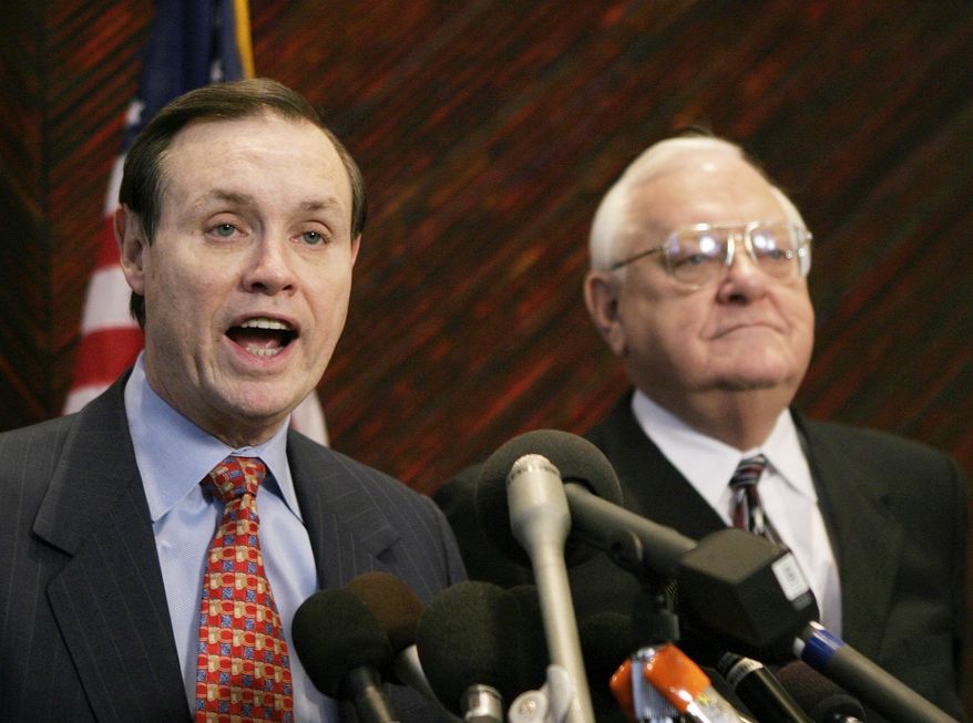 FILE - This Dec. 23, 2003 file photo shows Dan Webb, left, attorney for former Illinois Gov. George Ryan, right, during a news conference in Chicago. The city of Ferguson, Mo., is paying Webb $1,335 an hour to help the St. Louis suburb negotiate and possibly litigate reforms pressed by the Justice Department since Michael Brown's shooting death by a police officer there last summer, according to a newspaper report. (AP Photo/Brian Kersey, File)