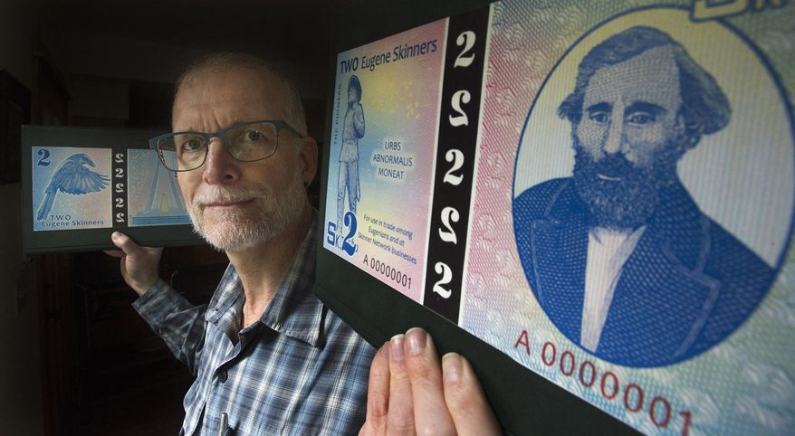 In this April 28, 2015 photo, writer Bruce Holland Rogers holds an artist rendition of a $2 dollar Eugene Skinner note in Eugene, Ore. Rogers plans to make the currency, which he calls Skinners (after city founder Eugene Skinner), available sometime this summer. (Andy Nelson/The Register-Guard via AP)