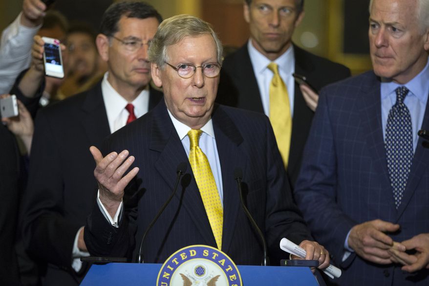 Senate Majority Leader Sen. Mitch McConnell of Ky., accompanied by, from left, Sen. John Barrasso, R-Wyo., Sen. John Thune, R-S.D., and Senate Majority Whip John Cornyn of Texas, speaks during a news conference on Capitol Hill in Washington, Tuesday, May 5, 2015, after a policy luncheon. (AP Photo/Evan Vucci)