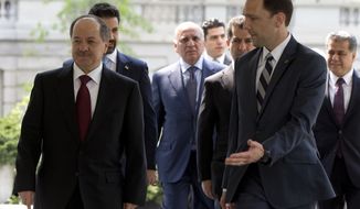 Iraqi Kurdistan Regional President Masoud Barzani, left, is escorted into West Wing of the White House in Washington, Tuesday, May 5, 2015, where he is scheduled to meet with Vice President Joe Biden. (AP Photo/Carolyn Kaster)