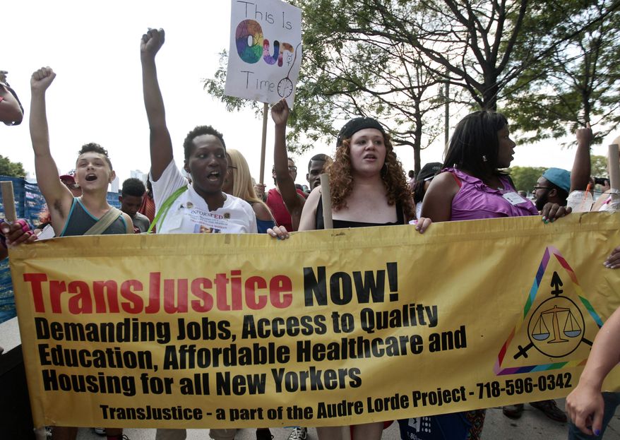 In this June 27, 2014, file photo, people march during the 10th annual Trans Day of Action in New York. (AP Photo/Frank Franklin II, File)