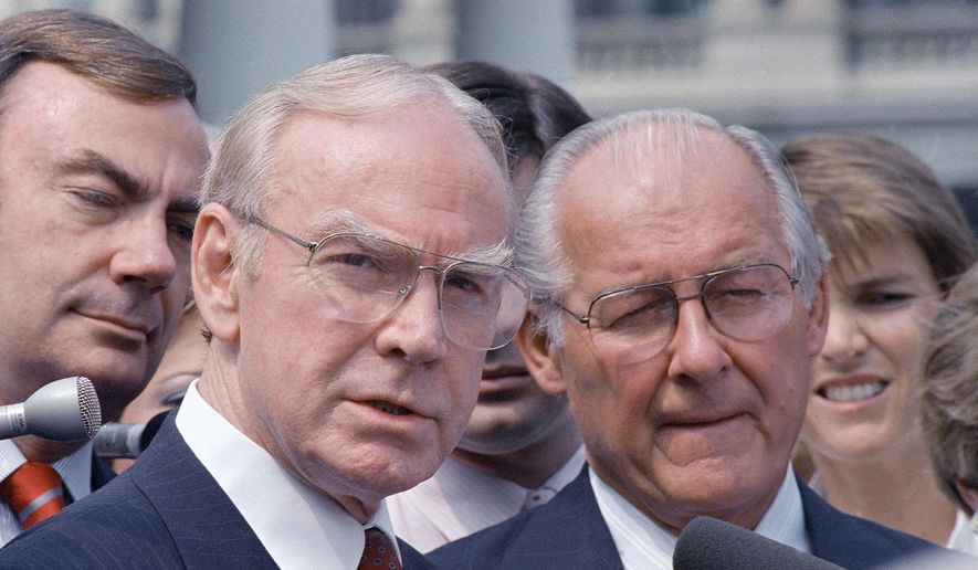 In this Aug. 5, 1987, file photo, then-House Speaker Jim Wright of Texas, left, and then-House Minority Leader Robert Michel of Illinois speak to reporters outside the White House in Washington. Wright, a veteran Texas congressman who was the first House speaker in history to driven out of office in midterm, has died. He was 92. (AP Photo/Barry Thumma, File)