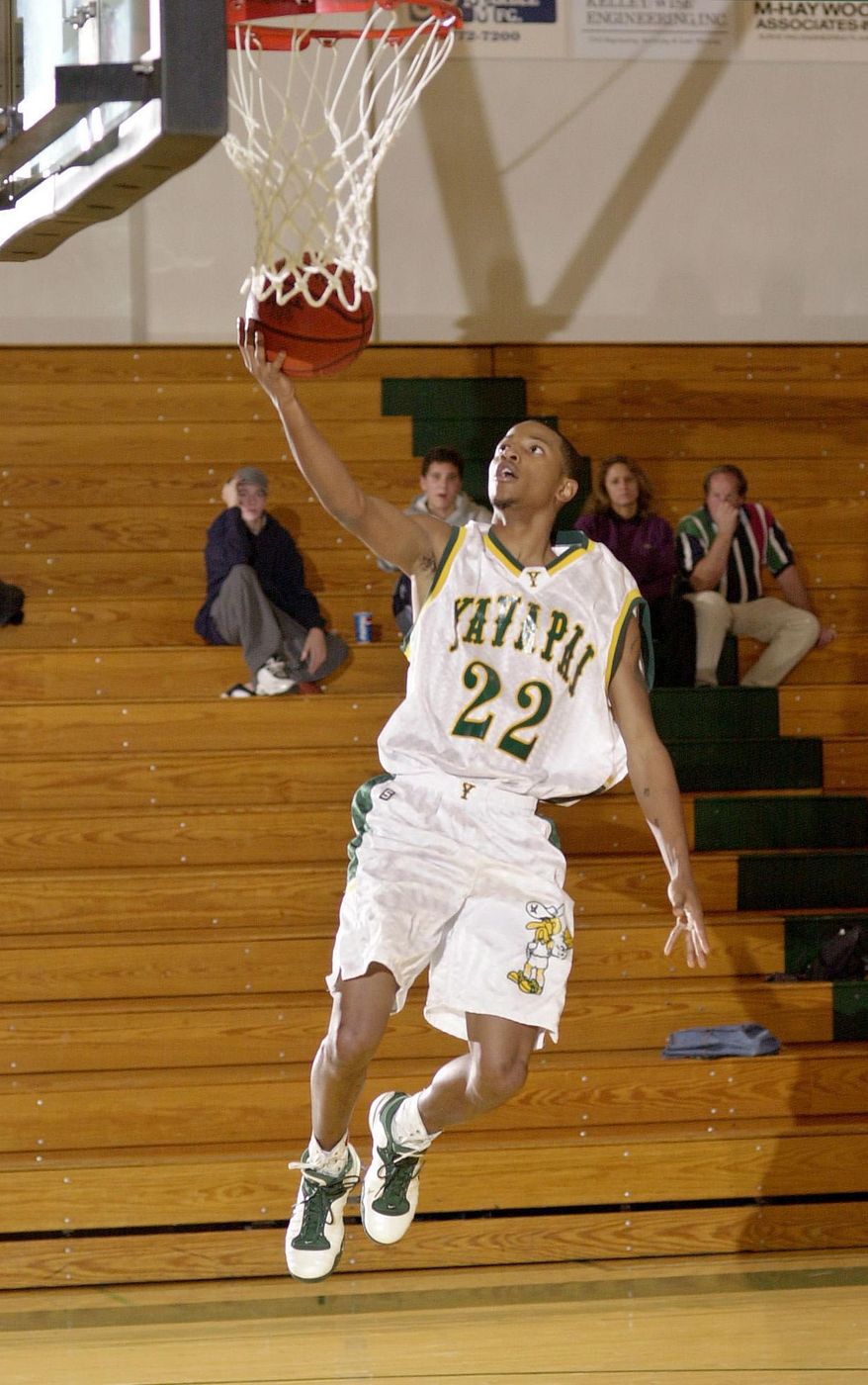 FILE - In this Jan. 3, 2003 file photo, Elton Simpson goes uncontested for a layup during a Yavapai College basketball game in Prescott, Ariz. Simpson was one of the two gunmen who was shot and killed by authorities outside a suburban Dallas venue Sunday, May 3, 2015 which was hosting a contest for Muslim Prophet Muhammad cartoons. The gunmen, whom federal officials identified as Simpson and Nadir Soofi, wounded a security officer before they were shot and killed at the scene. (Les Stukenberg/The Daily Courier via AP) MANDATORY CREDIT: LES STUKENBERG/THE DAILY COURIER