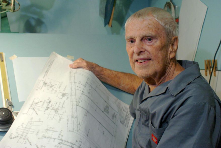 In this photo taken Sept. 2, 2008, engineer Oscar Carl Holderer, one of Wernher von Braun's original "Operation Paperclip" team members, holds some technical drawings in his home shop behind his house in Huntsville, Ala. Holderer, the last known surviving member of the German engineering team that came to the United States after World War II and designed the rocket that took astronauts to the moon, died Tuesday, May 5, 2015 in Huntsville, Ala. He was 95. (Eric Schultz/AL.com via AP)MANDATORY CREDIT